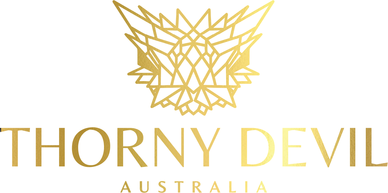Gold logo of 'Thorny Devil Australia' on a white background
